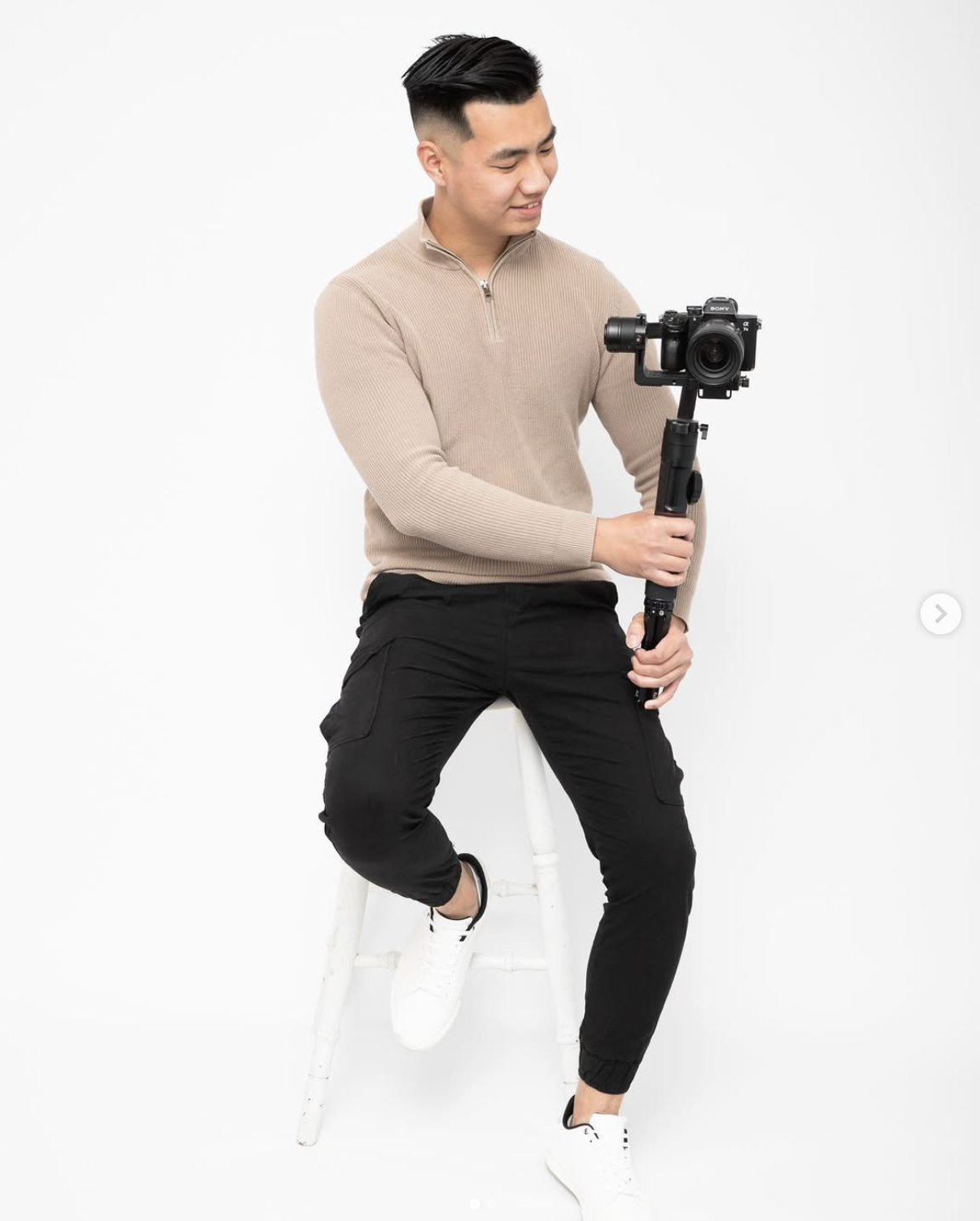 Aaron holding a gimbal-mounted mirrorless camera in the studio